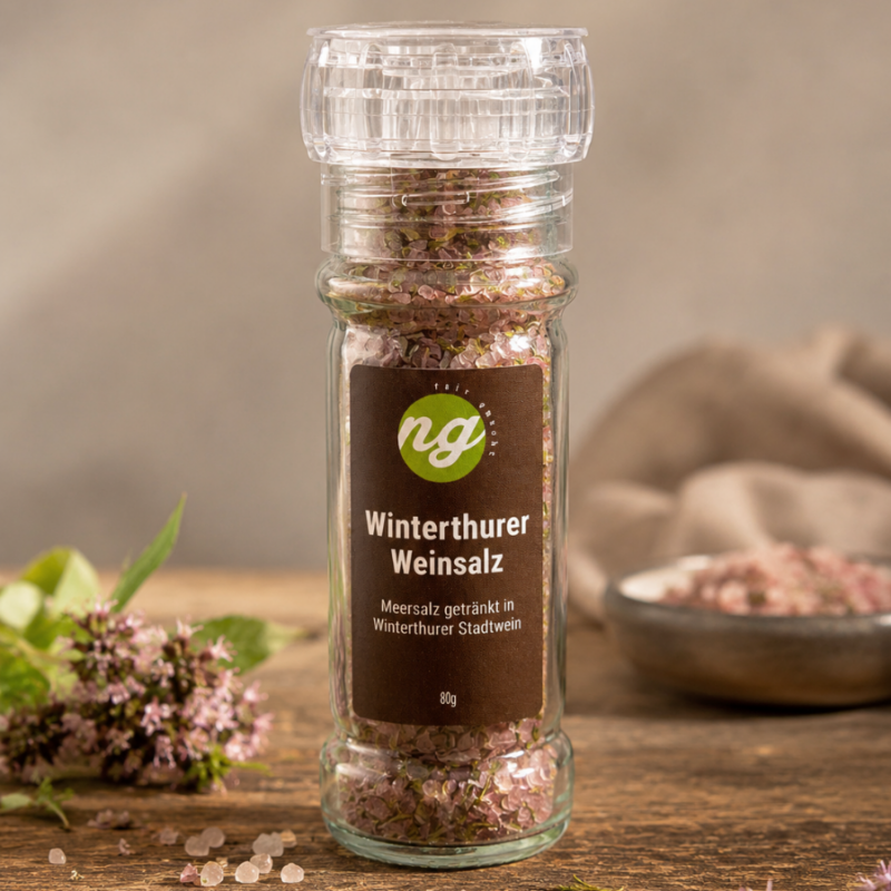 Glass spice bottle filled with pink salt crystals, labeled 'Winterthurer Weinsalz' (80 g), brand 'ng' visible on the dark label.